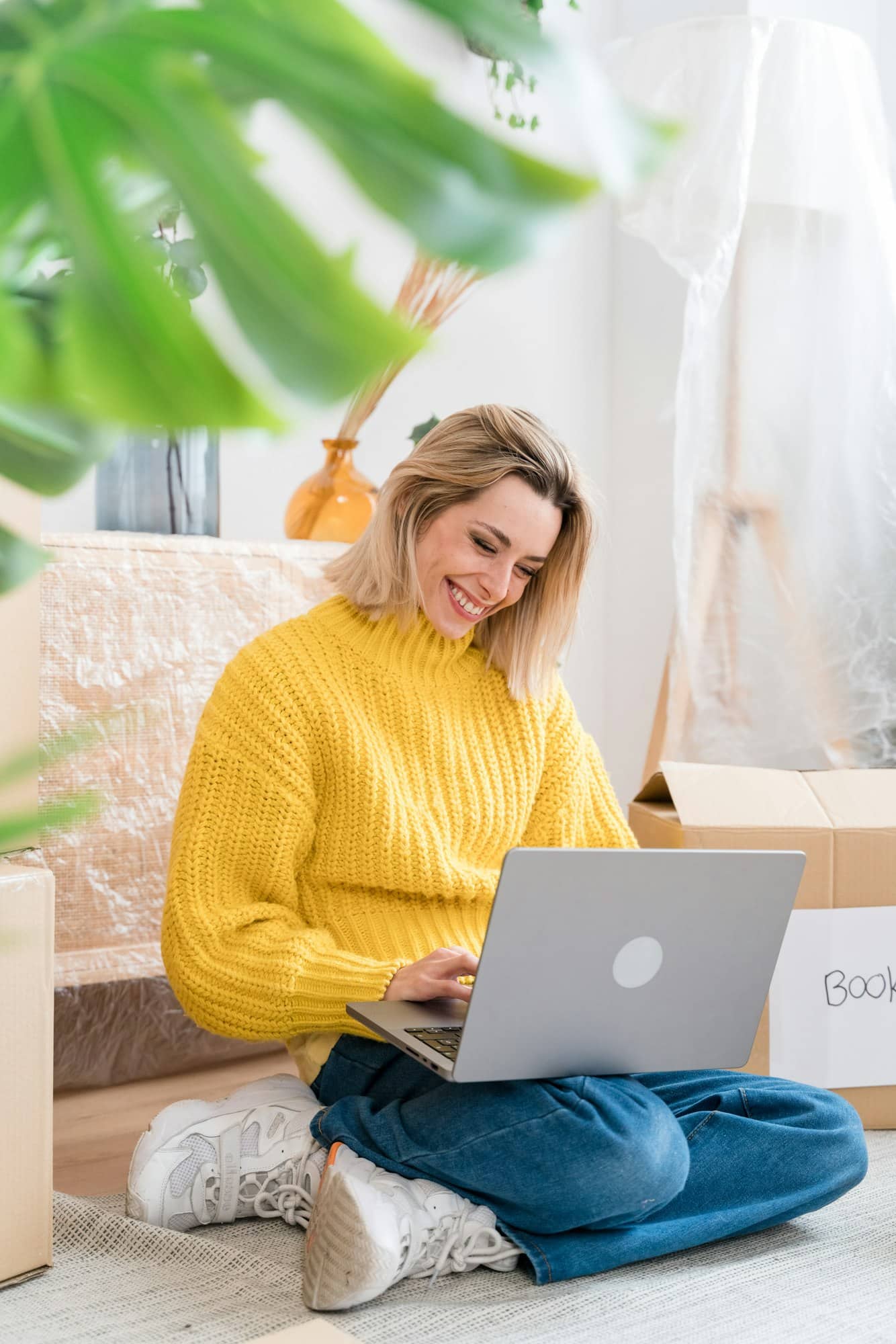 Happy woman working on laptop